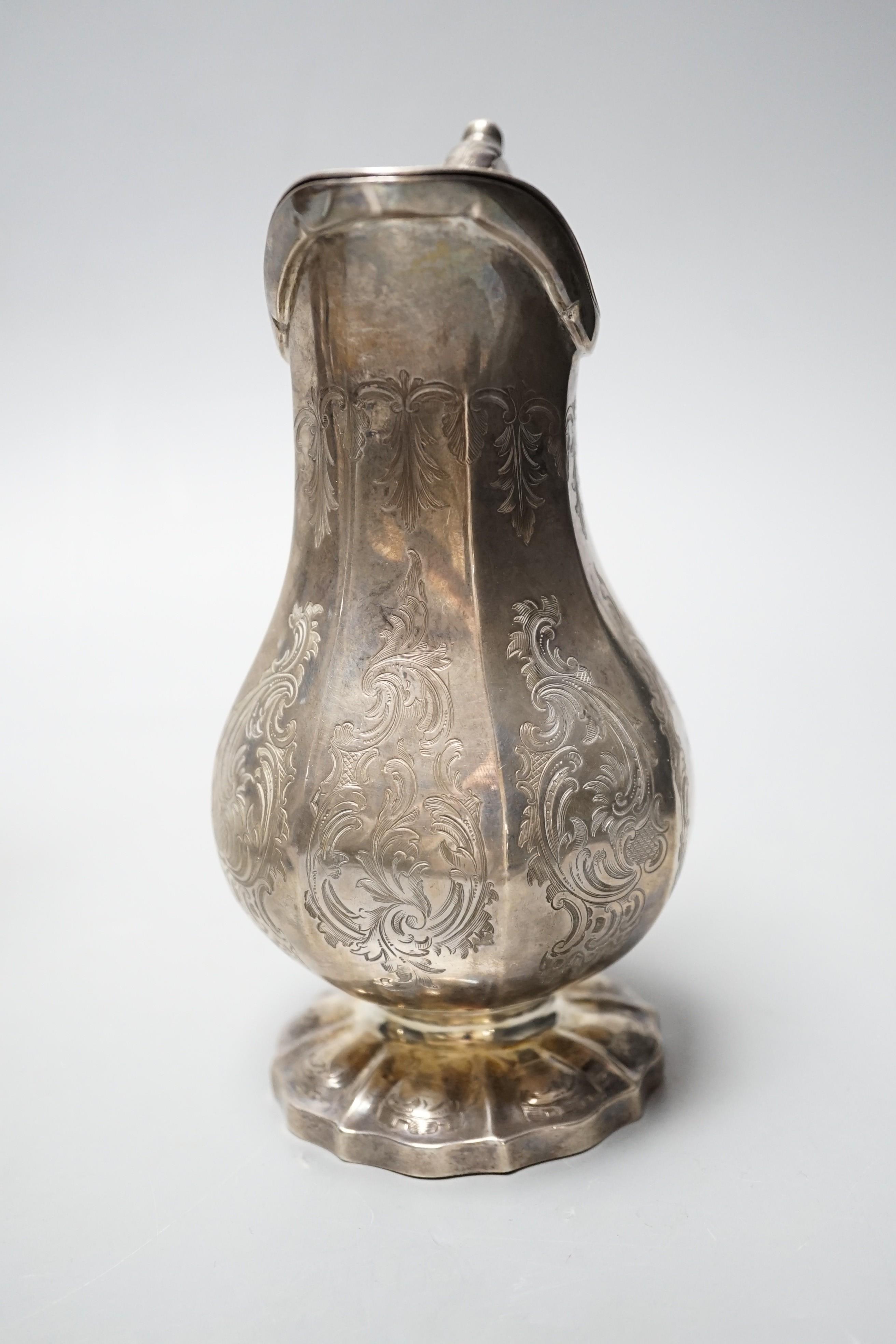 An early Victorian panelled pear shaped silver lidded cream jug, Charles & George Fox, London, 1845, 16.7cm, 9.5oz.